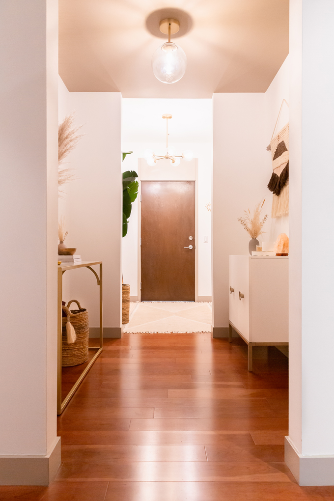 Space Refresh: Entrance Way Reveal in Partnership with Mobilia Canada | A Bohemian, Mid-Century Modern Apartment Entrance Way | Justine Celina Maguire’s Home | 2019 Home Decor Trends | Behr Ultra Pure White | Mobilia Aly Velji Modern India Collection Review | Bohemian, Mid Century Modern Decor | Faux Bird of Paradise Plant | Calgary Lifestyle, Interior Design and Home Decor Blogger // JustineCelina.com