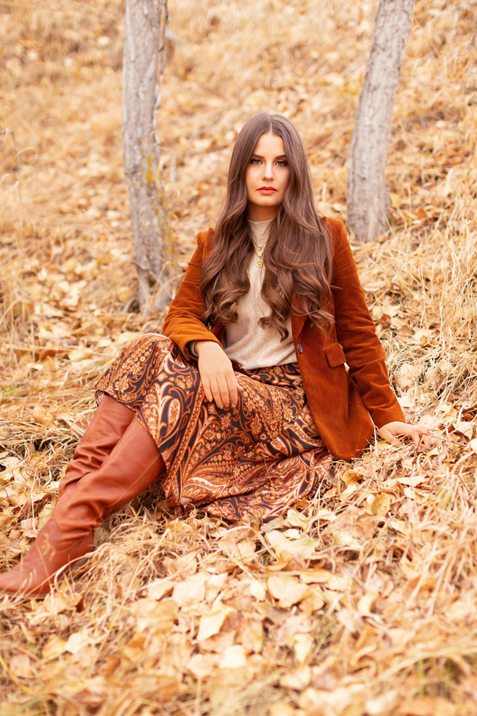 Autumn 2019 Lookbook: Equestrian Influence | Top Fall / Winter 2019 Trends | Top Autumn 2019 Trends and How to Wear Them | H&M x Richard Allen Collection Review |  Brunette woman wearing H&M x Richard Allen Skirt with Belt, Cognac Corduroy Blazer, H&M Fine Knit Swearer in Beige and Lucky Brand Azoola Boots surrounded by fall leaves | Bohemian Fall / Winter 2019 Outfits | How to Style Paisley | How to Style Corduroy Top Calgary Fashion & Creative Lifestyle Blogger // JustineCelina.com