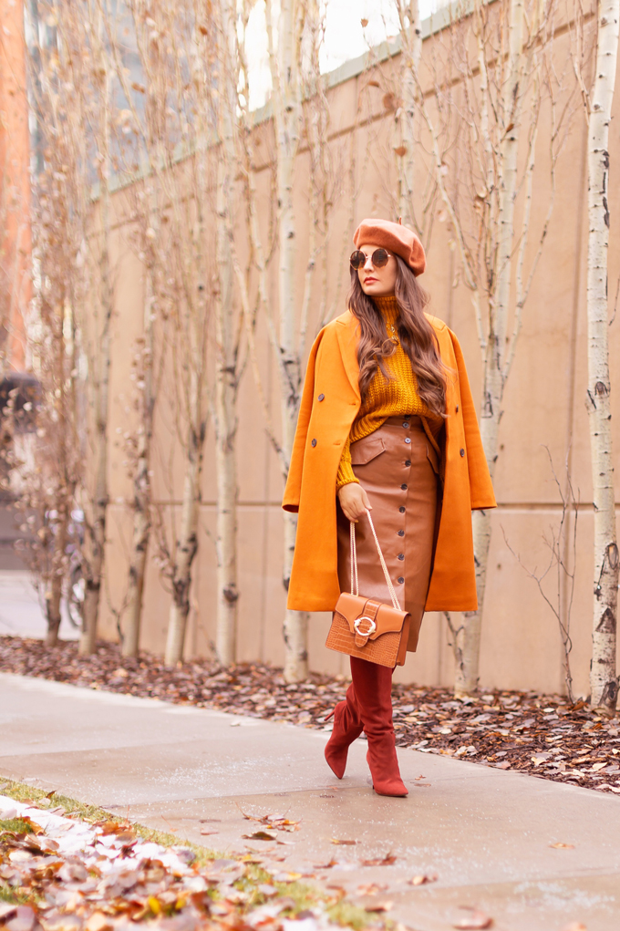 Autumn 2019 Lookbook: Pumpkin Spice | Top Fall / Winter 2019 Trends | Top Autumn 2019 Trends and How to Wear Them | Brunette woman wearing an orange coat with an H&M faux leather skirt, chunky mustard sweater, beret, rust suede boots and a croc embossed bag | Chic Fall / Winter 2019 Outfits | How to Wear the Pantone AW19/20 Fashion Colour Trend Report | How to Style a Faux Leather Skirt | How to Wear a Beret | Orange Monochromatic Outfit |  Top Calgary Fashion Blogger // JustineCelina.com