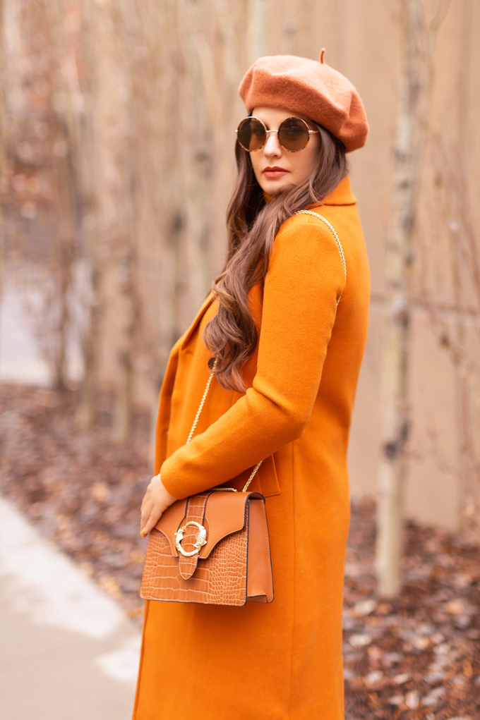 Autumn 2019 Lookbook: Pumpkin Spice | Top Fall / Winter 2019 Trends | Top Autumn 2019 Trends and How to Wear Them | Brunette woman wearing an orange coat with an H&M faux leather skirt, chunky mustard sweater, beret, rust suede boots and a croc embossed bag | Chic Fall / Winter 2019 Outfits | How to Wear the Pantone AW19/20 Fashion Colour Trend Report | How to Style a Faux Leather Skirt | How to Wear a Beret | Orange Monochromatic Outfit |  Top Calgary Fashion Blogger // JustineCelina.com