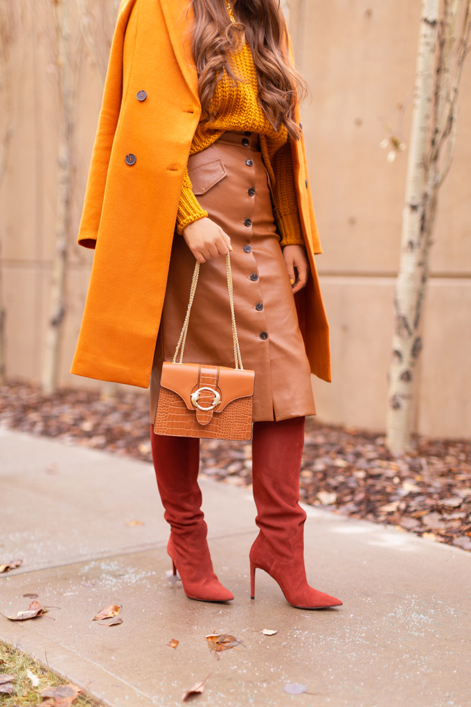 Autumn 2019 Lookbook: Pumpkin Spice | Top Fall / Winter 2019 Trends | Top Autumn 2019 Trends and How to Wear Them | Brunette woman wearing an orange coat with an H&M faux leather skirt, chunky mustard sweater, beret, rust suede boots and a croc embossed bag | Chic Fall / Winter 2019 Outfits | How to Wear the Pantone AW19/20 Fashion Colour Trend Report | How to Style a Faux Leather Skirt | How to Wear a Beret | Orange Monochromatic Outfit |  Top Calgary Fashion Blogger // JustineCelina.com