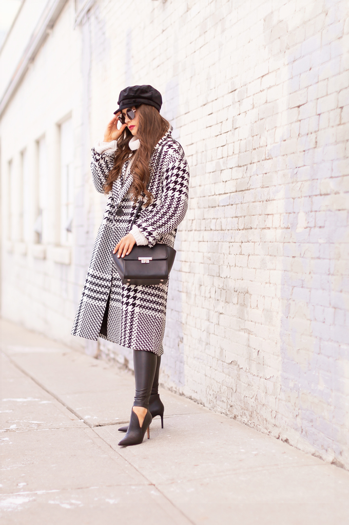 Autumn / Winter 2019 Lookbook: Houndstooth Chic | Top Fall / Winter 2019 / 2020 Trends | Top Winter 2019 / 2020 Trends and How to Wear Them | Brunette woman wearing a Zara Oversized Houndstooth Coat, Black Round Sunglasses, a Velvet Baker Boy Hat, a Chunky Cream Sweater, Black Faux Leather Leggings, and TopShop Leather Asymetric Ankle Booth | How to Style a Houndstooth for 2020 | How to Wear Houndstooth | Chic Winter Fashion Ideas | Top Calgary Fashion Blogger // JustineCelina.com