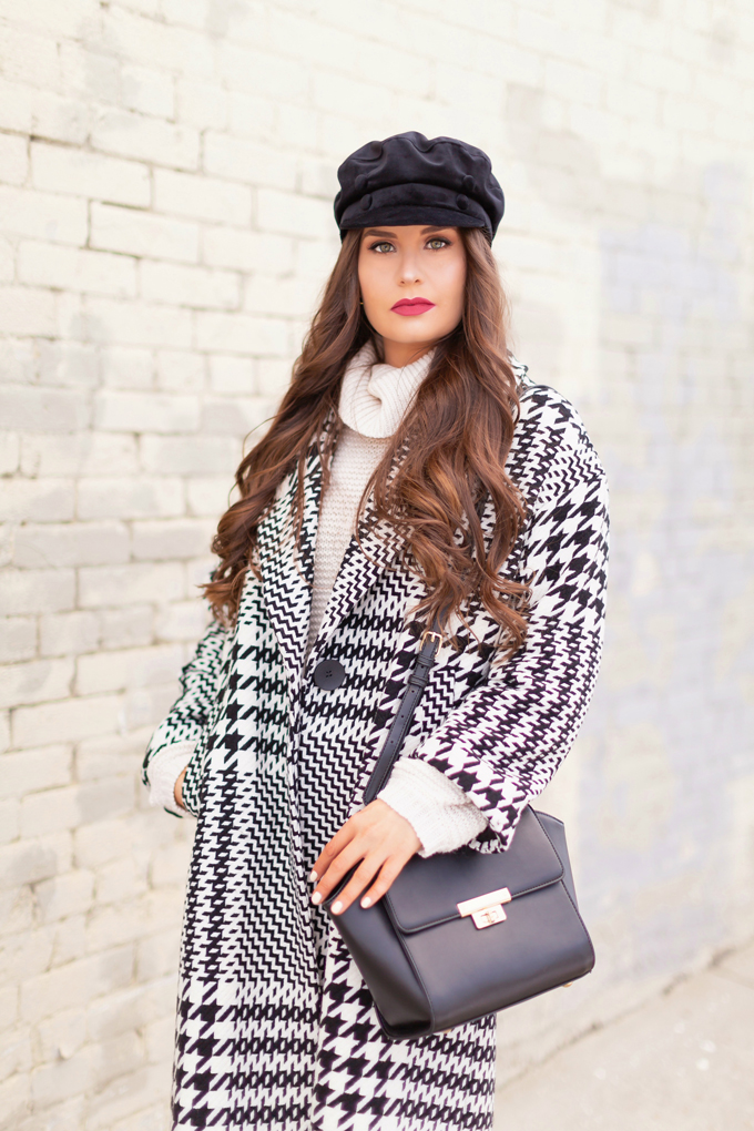 Autumn / Winter 2019 Lookbook: Houndstooth Chic | Top Fall / Winter 2019 / 2020 Trends | Top Winter 2019 / 2020 Trends and How to Wear Them | Brunette woman wearing a Zara Oversized Houndstooth Coat, Black Round Sunglasses, a Velvet Baker Boy Hat, a Chunky Cream Sweater, Black Faux Leather Leggings, and TopShop Leather Asymmetric Ankle Booth | How to Style a Houndstooth for 2020 | How to Wear Houndstooth | Chic Winter Fashion Ideas | Top Calgary Fashion Blogger // JustineCelina.com