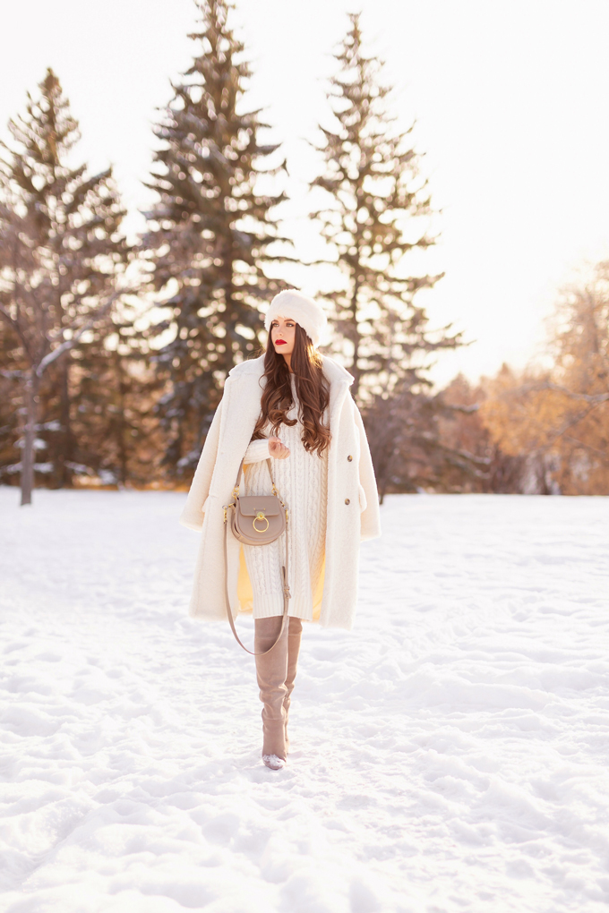 Autumn / Winter 2019 Lookbook: Winter Whites | Top Fall / Winter 2019 / 2020 Trends | Top Winter 2019 Trends and How to Wear Them | Brunette woman wearing a Mango Oversized Cream Teddy Coat, Cream Cable Knit Sweater Dress, Grey Over The Knee Boots and Grey Chloe Tess Dupe | Monochromatic Cream / White Outfit | Festive Winter Holiday Outfit | Christmas Dinner Outfit | Canadian Winter Outfit Ideas | How to Style a Faux Fur Headband | Top Calgary Fashion & Lifestyle Blogger // JustineCelina.com