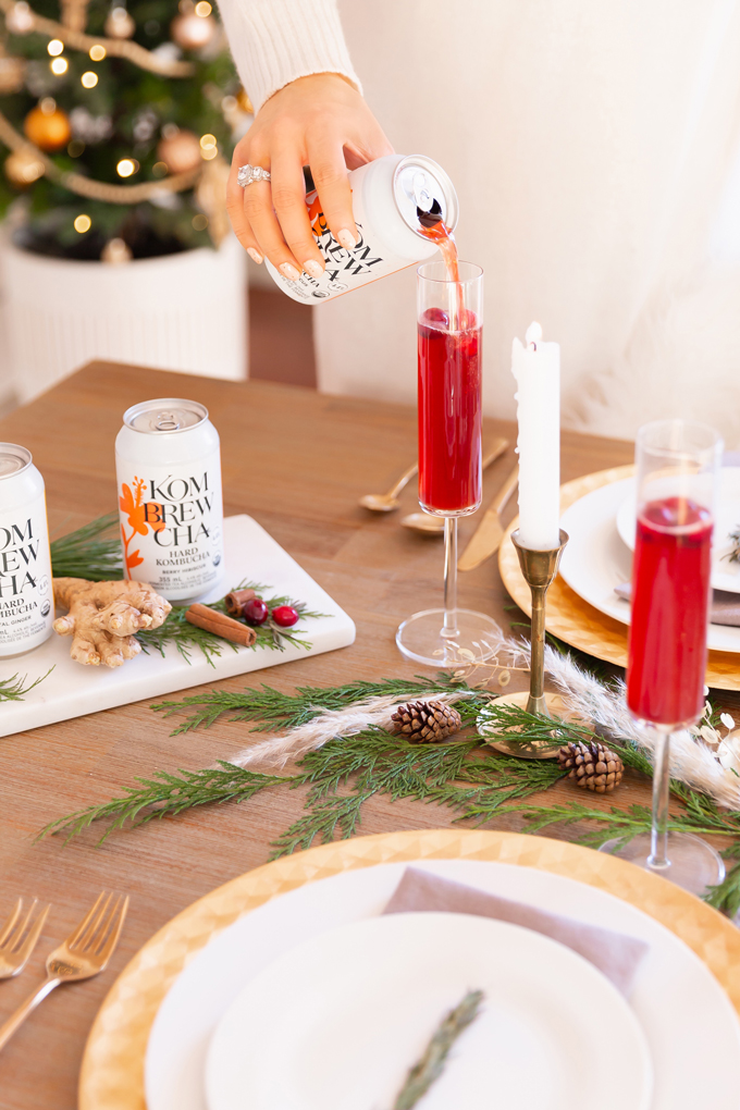 Easy Holiday Entertaining Ideas | Holiday Entertaining at Home | Stress Free Entertaining Tips | Holiday Cocktail Party | Easy Christmas Party Ideas | Simple Mid Century Modern Holiday Dinner Party | JustineCelina’s Mid Century Modern Bohemian Dining Room & Bar | Simple Festive Tablescape with Winter Greenery, Pampas Grass, Candles and Berry Hibiscus Kombrewcha | Kombrewcha available in Alberta | Kombrewca Review | Calgary Home Decor & Entertaining Blogger // JustineCelina.com