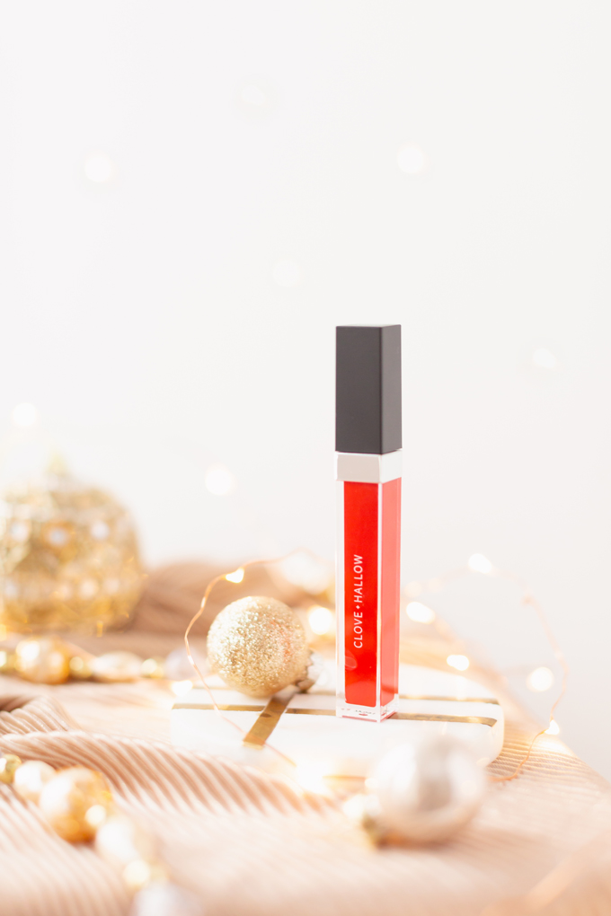 My Top 5 Red Lipsticks for the Holidays | Clove + Hallow Lip Velvet in Fiesta photos, review, swatches | Brunette woman wearing a festive red lipstick | best red lipstick for MAC NC 25 - 30 skin, best clean vegan red lipstick, best carmine free red lipstick, best lipstick for winter complexion, must have lipsticks 2019, best red liquid lipstick, best long lasting red lipstick, Christmas lipstick 2019, winter lipstick colors 2019 | Calgary Beauty Blogger // JustineCelina.com