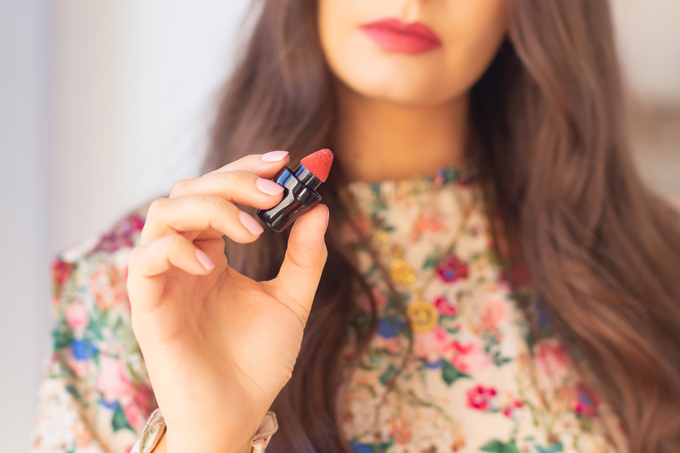 My Top 5 Rose Toned Lipsticks | JustineCelina’s most worn lipsticks | JustineCelina’s favourite lipsticks | Beauty Blogger’s Favourite Lipsticks | The best rose Lipsticks | Best Luxury Rose Colored Lipstick | Pink Lipstick for Medium Skin | Best Lipsticks Spring 2020 | Lancôme Matte Shaker High Pigment Liquid Lipstick in Beige Vintage Photos, Review, Swatches | Brunette woman wearing a floral dress applying liquid lipstick | Calgary Beauty & Lifestyle Blogger // JustineCelina.com