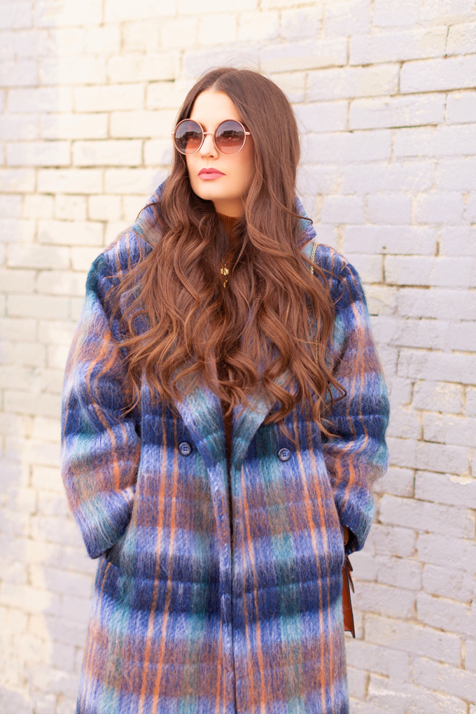 Colour Crush: Classic Blue | Brunette woman wearing a Classic Blue UO Oversized Plaid Wool Overcoat, Zara Straight Leg Blue Jeans, Mango Cognac Asymmetric Stiletto Shoes, H&M Brown Knit Turtleneck Sweater, TopShop Croc Embossed Crossbody Bag and Brown Circular Sunglasses in an urban Setting | How to Wear Pantone’s 2020 Color of the Year, Classic Blue | Pantone Color of The Year 2020 Fashion | Transitional Winter to Spring Fashion for Canadians | Calgary Fashion Blogger // JustineCelina.com