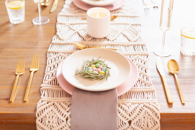 A Simple Easter Dinner for Two | JustineCelina’s Mid Century Modern Bohemian Dining Room Set for Easter | Easter Table Setting with a Rosemary and Mini Egg Birds Nest, Pastel Dinnerware, Champagne Flutes, Lemon Water, Gold Flatware, a Candle and Macrame Table Runner | Easter 2020 | Easter Entertaining at Home | Easter Floral Centrepieces | Easy Easter Decor Ideas | Mid Century Modern Easter Decor | Easy Easter Table Settings | Calgary Lifestyle and Decor Blogger // JustineCelina.com