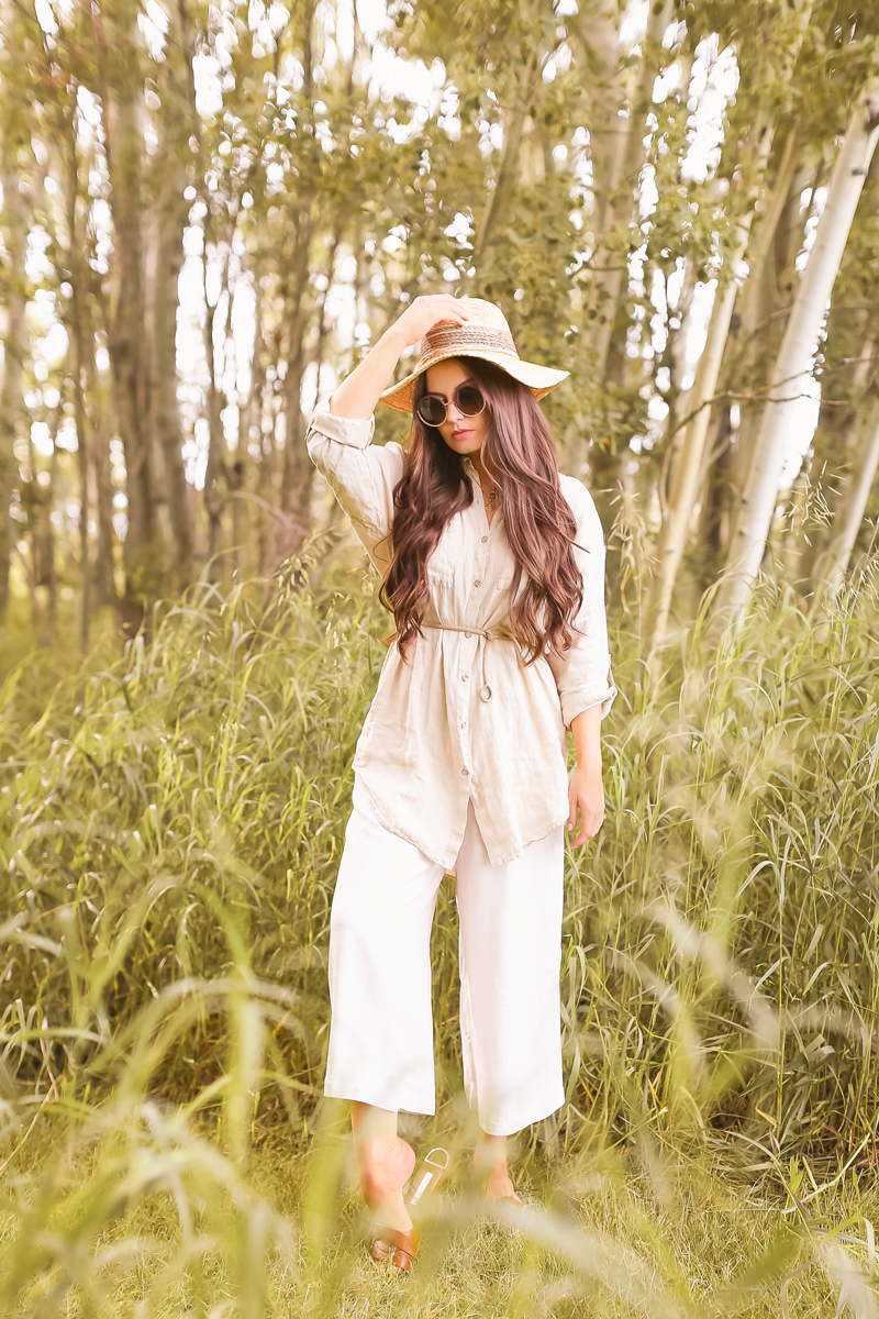 Summer 2020 Lookbook | Boho Summer 2020 Outfit Ideas | Summer Capsule Wardrobe | Summer Quarantine Outfits | Classic Summer Outfit Ideas | The Best Linen Pieces 2020 | The Best Affordable Linen Shirts and Culottes | Classic Linen Button Down Shirt | Summer Outfit Ideas | Classic Affordable Summer Style | Summer 2020 Trends | Brunette woman wearing a linen button-down shirt, H&M linen culottes and a straw hat in an Aspen tree grove | Calgary Alberta Fashion Blogger // JustineCelina.com