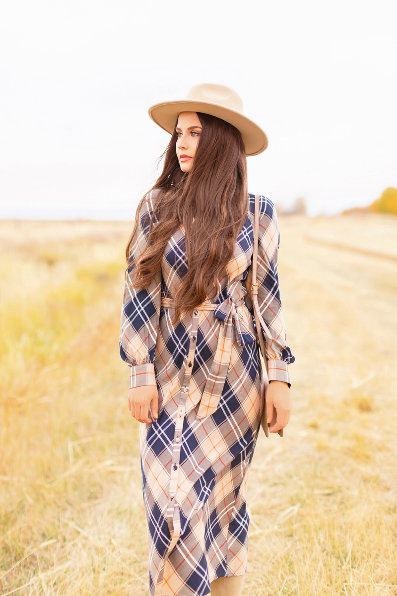 Early Autumn 2020 Lookbook | Brunette woman wearing a taupe flat brimmed fedora, a taupe, orange and navy blue plaid dress and a crossbody bag | Boho Fall 2020 Outfit Ideas | Top Fall 2020 Trends | Fall on the Alberta Prairies | How to Style Summer Dresses Into Fall | Thanksgiving Outfit Idea | Bohemian Fall outfit Ideas | Monochromatic Plaid Outfit Ideas | How to Style Knee High Boots for Fall | Cottagecore Fall Outfit Ideas | Calgary Alberta Fashion & Lifestyle Blogger // JustineCelina.com