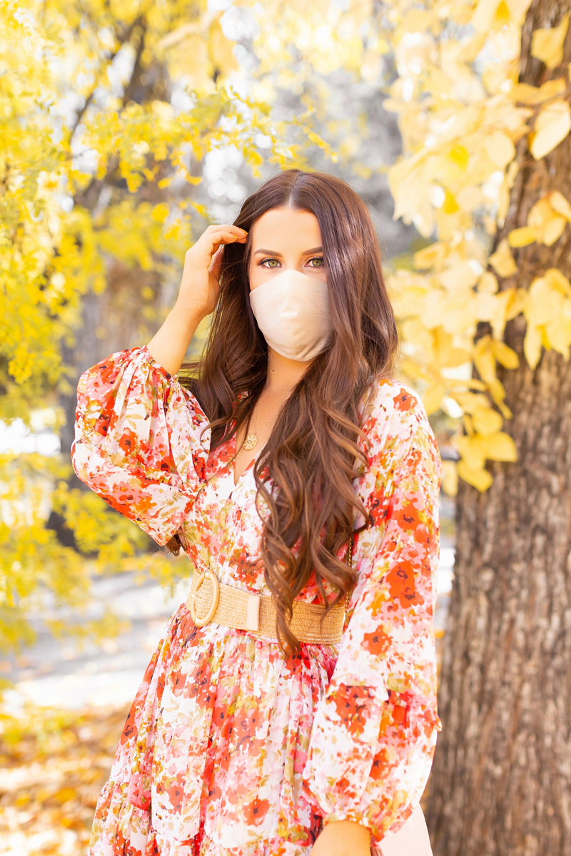 Early Autumn 2020 Lookbook | Brunette woman wearing a fall floral dress with statement sleeves and a rattan belt with a Katie May Collection Champagne Glow Up Face Mask | Boho Fall 2020 Outfit Ideas | Fall in Calgary | the best formal face masks 2020 | Triple layer formal face masks with a filter | Katie May Collection Facemask Review | Where to Buy Fabric Facemasks in Calgary | How to Style your Face mask to match your outfit | Calgary Alberta Fashion & Lifestyle Blogger // JustineCelina.com