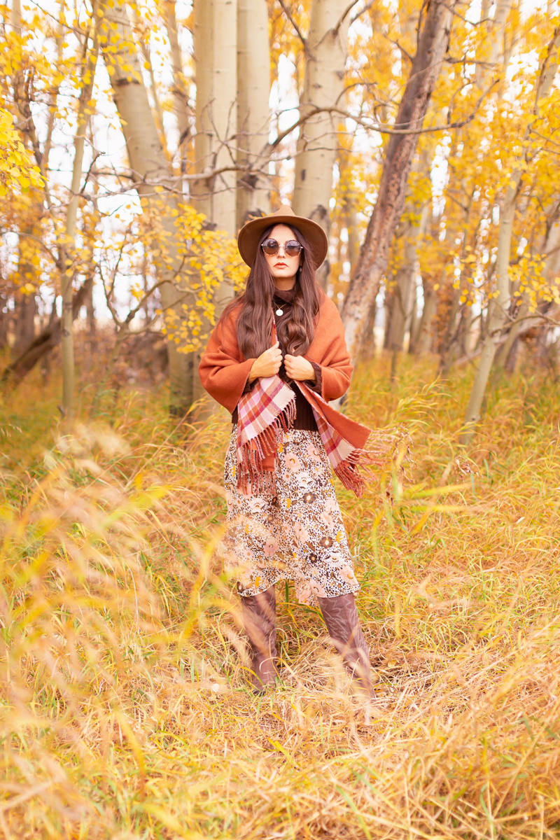 Fall 2020 Lookbook | A Lesson in Layering | Brunette woman wearing a fall floral midi dress, a brown turtleneck, a burnt orange shawl, brown western boots, a brown fedora and a round cognac crossbody bag amongst fall leaves | Boho Fall 2020 Outfit Ideas | Top Fall / Winter 2020 Trends | Bohemian Fall / Winter outfit Ideas | Cottagecore Fall / Winter Outfit Ideas | How to Style Midi Dresses into Fall and Winter | Creative Layering Ideas | Calgary Alberta Fashion Blogger // JustineCelina.com