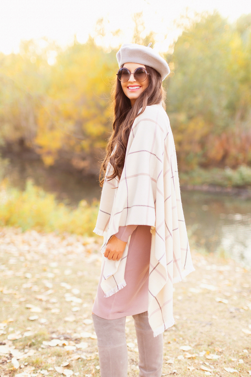 Fall 2020 Lookbook | Ruana Revival | Smiling brunette woman wearing a cream ruana poncho, cotton blush sweater dress, grey beret, grey round sunglasses and grey knee high suede boots | Boho Fall 2020 Outfit Ideas | Fall in Calgary | How to Style a Poncho | Comfortable Fall / Winter Outfit Ideas | Timeless Fall Outfit Ideas | fallwinter 2020 2021 fashion trends | fall 2020 womens fashion trends | Monochromatic Fall Outfit | Calgary Alberta Fashion Blogger // JustineCelina.com