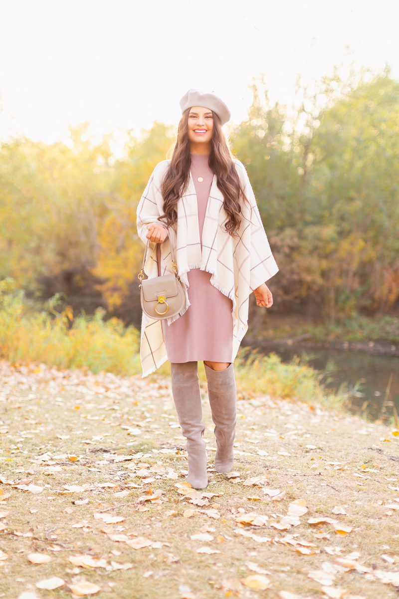 Fall 2020 Lookbook | Ruana Revival | Smiling brunette woman wearing a cream ruana poncho, cotton blush sweater dress, grey beret, grey Chloe Tess bag and grey knee high suede boots | Boho Fall 2020 Outfit Ideas | Fall in Calgary | How to Style a Poncho | Comfortable Fall / Winter Outfit Ideas | Timeless Fall Outfit Ideas | fallwinter 2020 2021 fashion trends | fall 2020 womens fashion trends | Monochromatic Fall Outfit | Calgary Alberta Fashion Blogger // JustineCelina.com