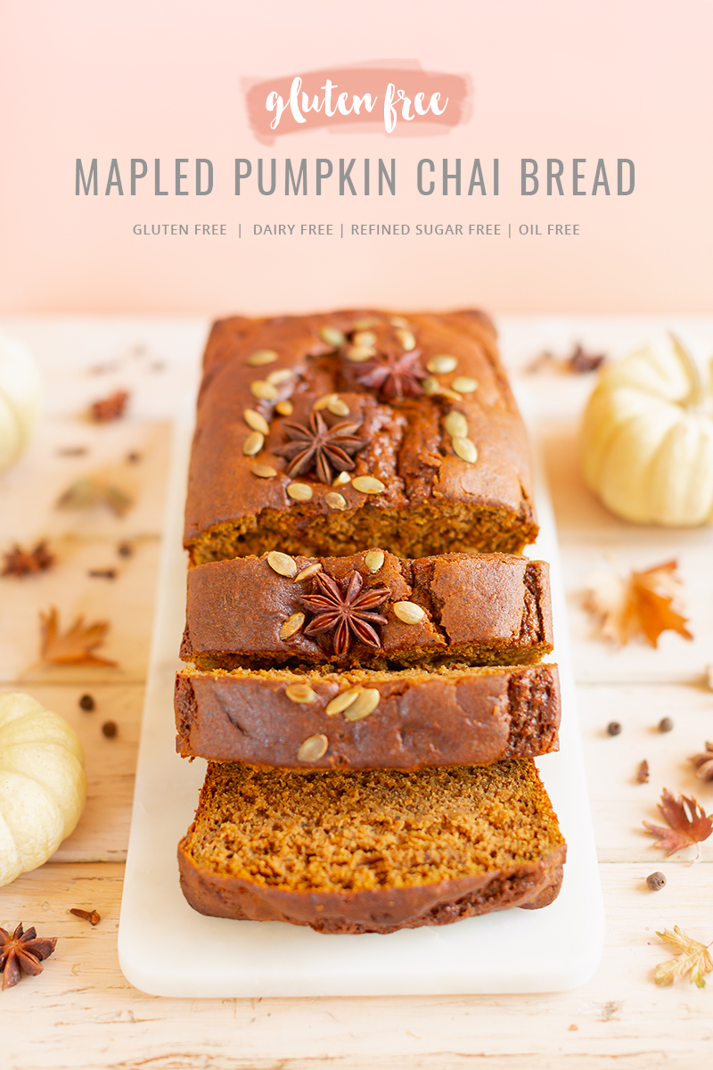 Gluten Free Mapled Pumpkin Chai Bread | Sliced Pumpkin Bread on a Marble Serving Board, served on 2 pink plates with gold forks and a chai latte | Chai Spice Bread styled with spices and white mini pumpkins arranged on blush pink barn board backdrop | Easy Pumpkin Bread | Moist Pumpkin Bread | The Best Gluten Free Fall Baking Recipes | No Sugar Pumpkin Bread | Maple Syrup Pumpkin Bread | Pumpkin Bread Cake | Healthy Pumpkin Bread | Calgary Plant Based Food Blogger // JustineCelina.com