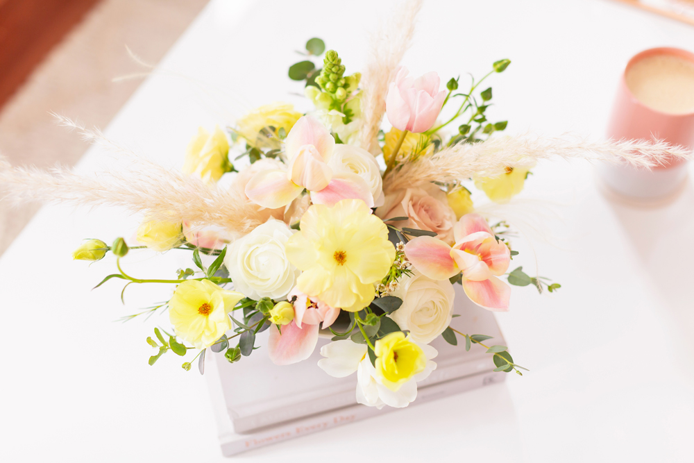 A Pastel Easter Flower Arrangement featuring Quicksand and Spray Roses, Ranunculus and Butterfly Ranunculus, Tulips, Hyacinths, Lisianthus, Eucalyptus, Wax Flowers and Pampas Grass | Calgary Lifestyle Blogger // JustineCelina.com