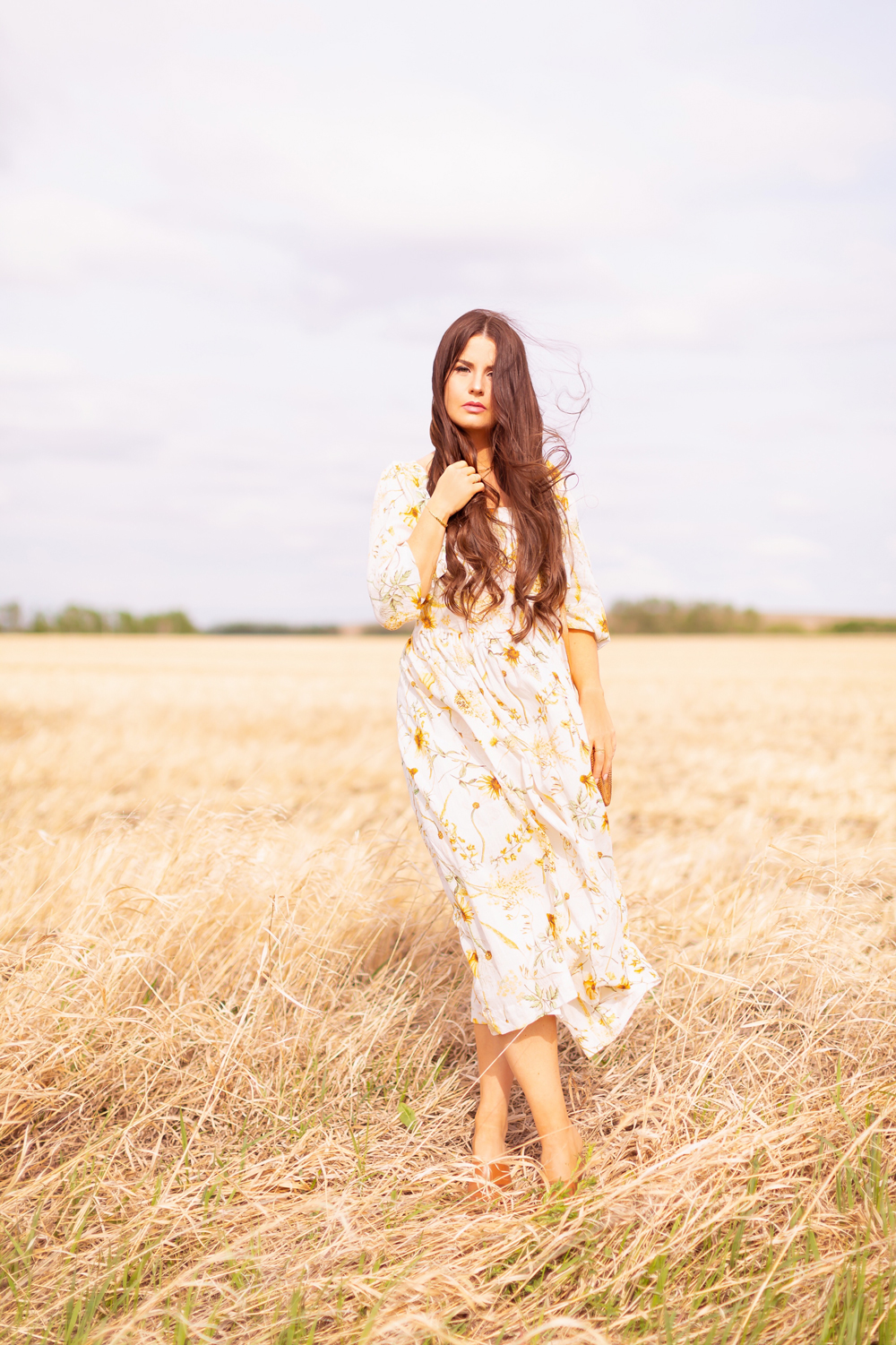 H&M Wildflower Collection Review | Brunette woman wearing a H&M A Meadow of Wildflowers Collection Long Crinkled Dress sitting in a wheat field in the wind | H&M Wildflower Collection Canada | H&M Wildflower Collection Canada | Spring/Summer 2021 Trends | The Best Cotton Dresses 2021 | Boho Spring / Summer Outfit Ideas | The Best H&M Dresses Summer 2021 | Alberta Wildflower Field | Cottage Core Fashion | Cottagecore Outfits | Calgary Creative Lifestyle & Fashion Blogger // JustineCelina.com