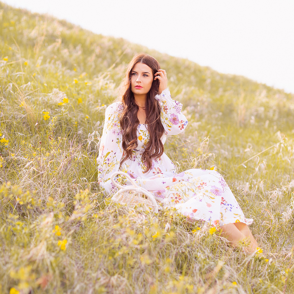 H&M Wildflower Collection Review | Brunette woman wearing a H&M A Meadow of Wildflowers Collection Smock-Detail Dress on a rolling hill with yellow wildflowers | H&M Wildflower Collection Canada | H&M Wildflower Collection Canada | Spring/Summer 2021 Trends | The Best Cotton Dresses 2021 | Boho Spring / Summer Outfit Ideas | The Best H&M Dresses Summer 2021 | Alberta Wildflower Field | Cottage Core Fashion | Cottagecore Outfits | Calgary Creative Lifestyle & Fashion Blogger // JustineCelina.com