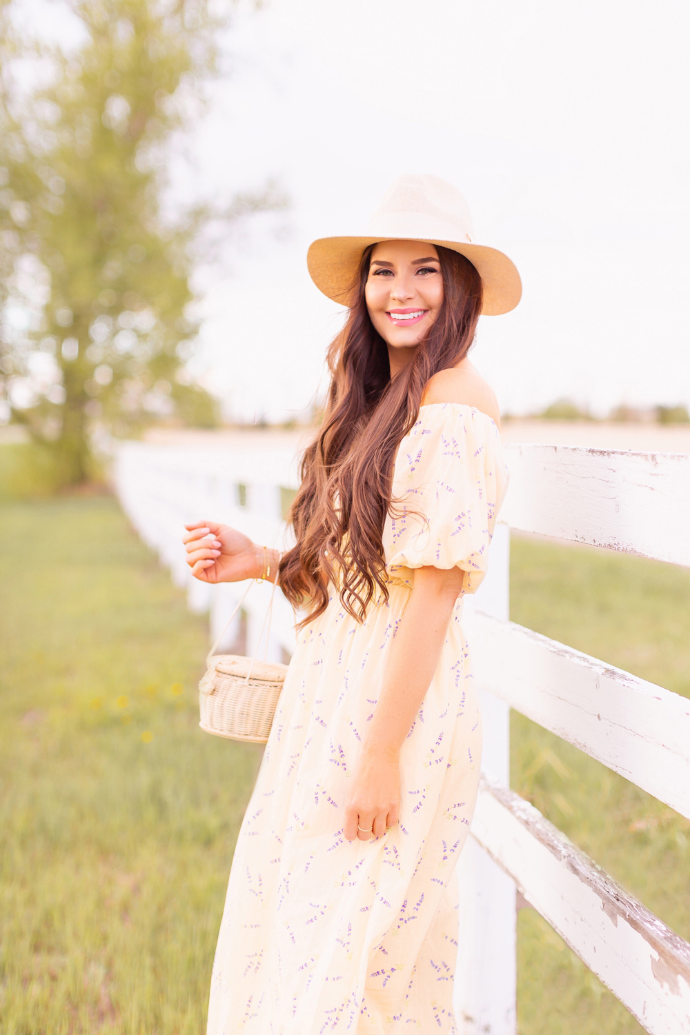 H&M Wildflower Collection Review | Brunette woman wearing a H&M A Meadow of Wildflowers Collection Off-the-shoulder Dress on an acreage with a white fence | H&M Wildflower Collection Canada | H&M Wildflower Collection Canada | Spring/Summer 2021 Trends | The Best Cotton Dresses 2021 | Boho Spring / Summer Outfit Ideas | The Best H&M Dresses Summer 2021 | Alberta Wildflower Field | Cottage Core Fashion | Calgary Creative Lifestyle & Fashion Blogger // JustineCelina.com