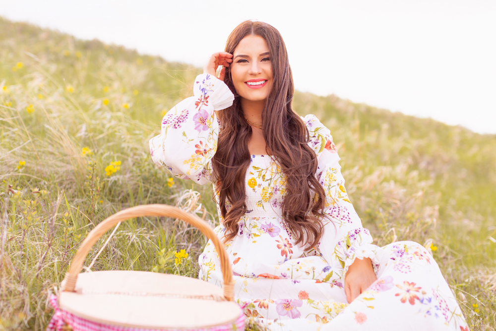 H&M Wildflower Collection Review | Brunette woman wearing a H&M A Meadow of Wildflowers Collection Smock-Detail Dress sitting on a rolling hill with yellow windflowers | H&M Wildflower Collection Canada | H&M Wildflower Collection Canada | Spring/Summer 2021 Trends | The Best Cotton Dresses 2021 | Boho Spring / Summer Outfit Ideas | The Best H&M Dresses Summer 2021 | Alberta Wildflower Field | Cottage Core Fashion | Cottagecore Outfits | Calgary Creative Lifestyle & Fashion Blogger // JustineCelina.com