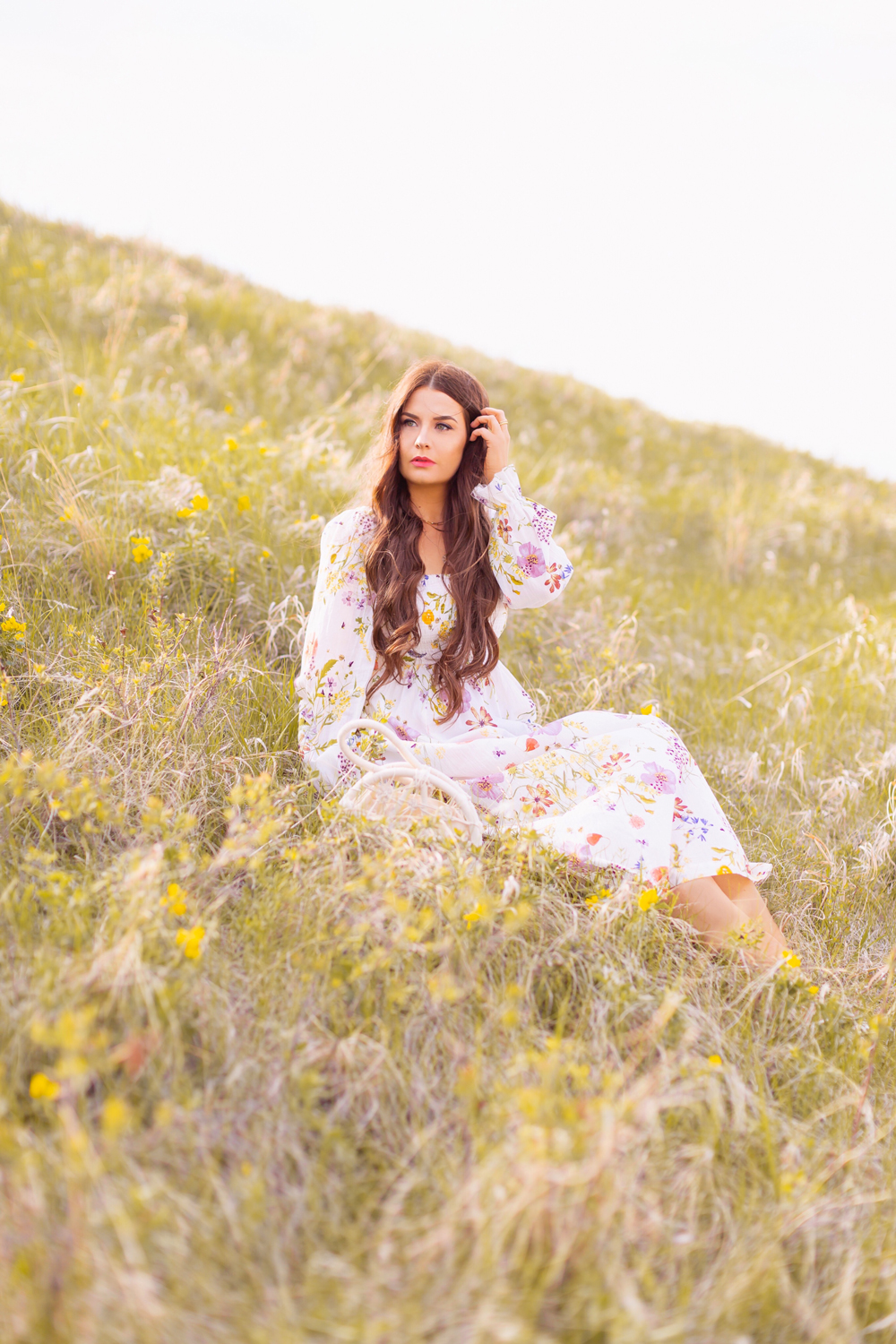H&M Wildflower Collection Review | Brunette woman wearing a H&M A Meadow of Wildflowers Collection Smock-Detail Dress sitting in a prairie field with yellow sunflowers | H&M Wildflower Collection Canada | H&M Wildflower Collection Canada | Spring/Summer 2021 Trends | The Best Cotton Dresses 2021 | Boho Spring / Summer Outfit Ideas | The Best H&M Dresses Summer 2021 | Alberta Wildflower Field | Cottagecore Outfits | Calgary Creative Lifestyle & Fashion Blogger // JustineCelina.com