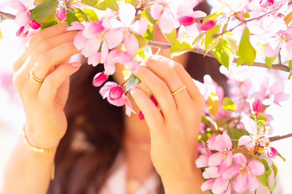 My Joydrop Calgary Jewelry Collection | Brunette woman amongst a blooming cherry blossom tree wearing a Gorjana & Griffin Crew Ring Set  | JustineCelina’s Signature Jewelry | Spring / Summer 2021 Jewelry Trends | Top Accessory Trends Spring / Summer 2021 | The Best Gold Plated Croissant Rings | Jewelry Trends Summer 2021 | Boho Jewelry Trends 2021 | The Best Gold Plated Jewelry Canada | Calgary Lifestyle and Fashion Blogger // JustineCelina.com