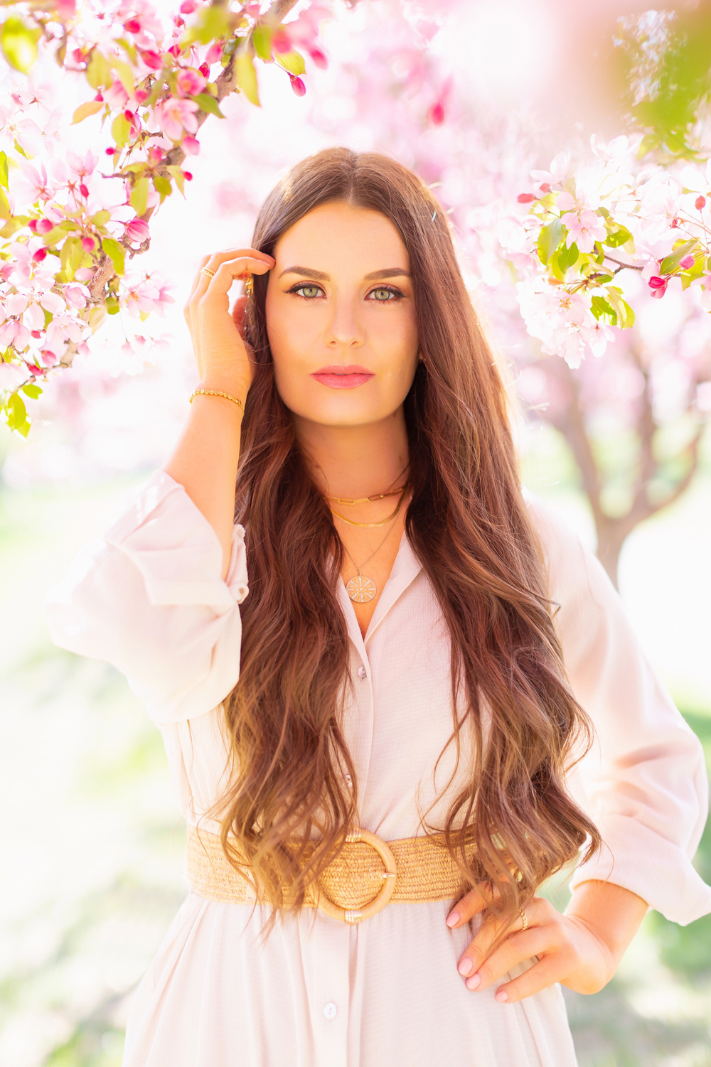 My Joydrop Calgary Jewelry Collection | Brunette woman amongst a blooming cherry blossom tree wearing a Paperclip Necklace, Herringbone Gold Snake Chain Necklace and Gold Coin Pendant Necklace Stack with a Gold Plated Bracelet and Gold Croissant Stacking Rings | JustineCelina’s Signature Jewelry | Spring / Summer 2021 Jewelry Trends | Necklace Stack Spring / Summer 2021 | Jewelry Trends Summer 2021 | The Best Gold Plated Jewelry Canada | Calgary Lifestyle and Fashion Blogger // JustineCelina.com