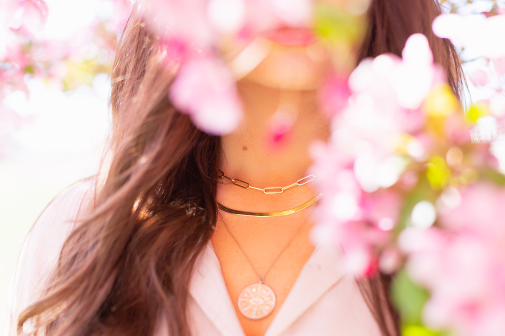 My Joydrop Calgary Jewelry Collection | Brunette woman amongst a blooming cherry blossom tree wearing a Paperclip Necklace, Prima Herringbone Gold Snake Chain Necklace and Gold Coin Pendant Necklace Stack | JustineCelina’s Signature Jewelry | Spring / Summer 2021 Jewelry Trends | Necklace Stack Spring / Summer 2021 | How to layer gold necklaces | Jewelry Trends Summer 2021 | The Best Gold Plated Jewelry Canada | Calgary Lifestyle and Fashion Blogger // JustineCelina.com