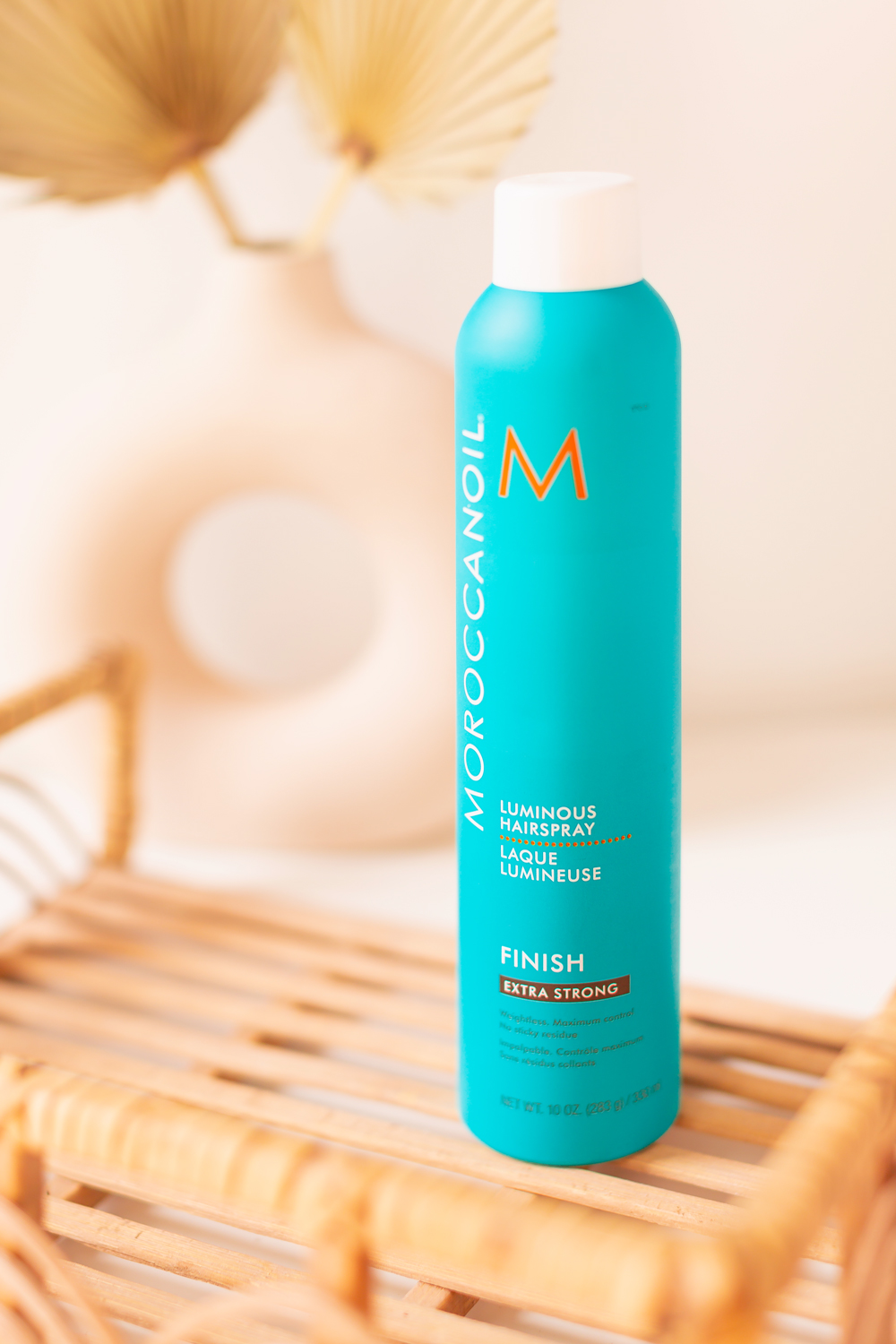 Moroccanoil Luminous Hairspray Extra Strong Photos, Review | Teal blue bottle of hairspray on a boho rattan tray| JustineCelina’s Haircare Routine for Long, Thick, Colour Treated Hair | Color-safe, sulphate free, phosphate free and paragon free haircare routine | MoroccanOil haircare routine | BeautySense review | JustineCelina’s favourite leave-in hair treatments | JustineCelina Hair | Hair growth tips | Hair growth products | Long Hair Secrets | Calgary Beauty Blogger // JustineCelina.com