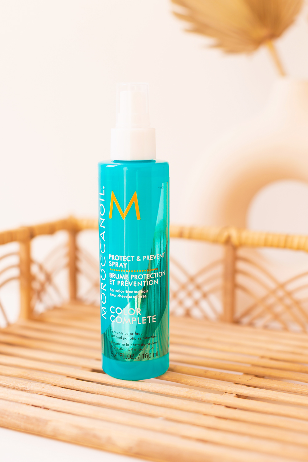 Moroccanoil Protect & Prevent Spray Photos, Review | Teal blue leave-in spray on a boho rattan tray| JustineCelina’s Haircare Routine for Long, Thick, Colour Treated Hair | Color-safe, sulphate free, phosphate free and paragon free haircare routine | MoroccanOil haircare routine | BeautySense review | JustineCelina’s favourite leave-in hair treatments | JustineCelina Hair | Hair growth tips | Hair growth products | Long Hair Secrets | Calgary Beauty Blogger // JustineCelina.com