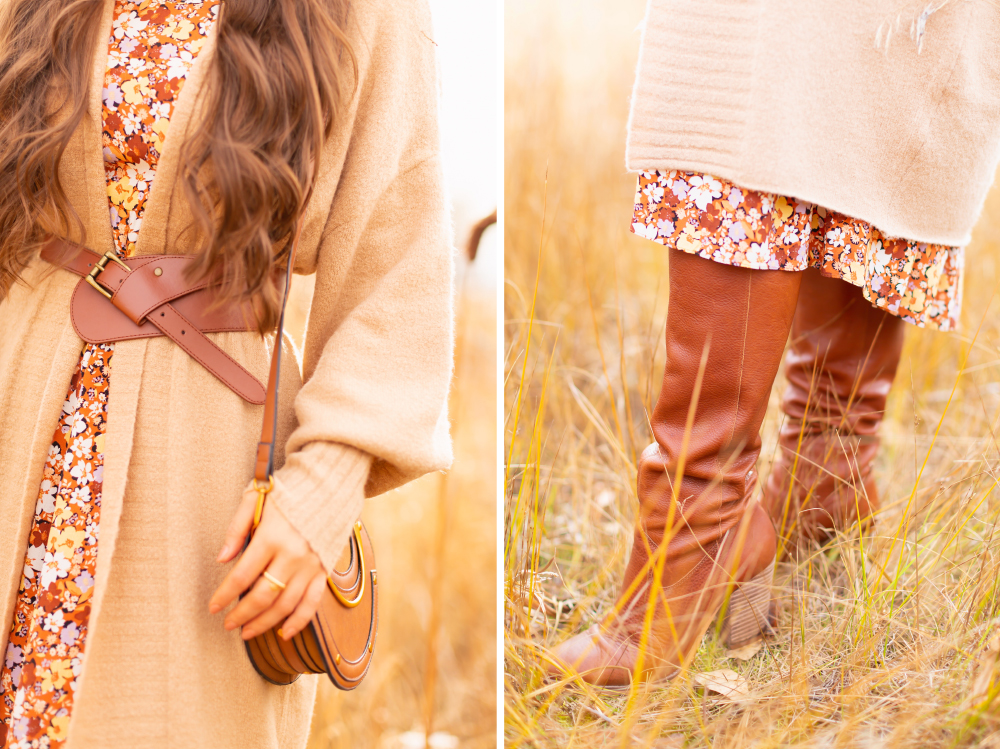 6 Luxe Bohemian Fall Outfits | Elegant Equestrian | Details of a woman wearing a fall floral midi dress, a longline camel cardigan, a cognac leather corset belt, a round cognac crossbody bag and and Lucky Brand Whiskey Azoola Leather Boot amongst cattails | Boho Fall 2022 Outfit Ideas | Classic Fall Outfit Formulas | Feminine Bohemian Style | Polished Bohemian Style | Elegant Bohemian Style | Bohemian Outfit Ideas | Boho Fall Accessories | Calgary Alberta Fashion Blogger // JustineCelina.com