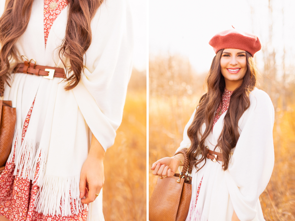 6 Luxe Bohemian Fall Outfits | Playful Poncho | Detail photo of a brunette woman wearing a fall floral mini dress, a cream fringe trimmed poncho belted at the waist with a cognac leather corset belt and a woven cognac crossbody bag amongst golden grasses and trees | Boho Fall 2022 Outfit Ideas | Classic Fall Outfit Formulas | Feminine Bohemian Style | Polished Bohemian Style | Elegant Bohemian Style | Bohemian Outfit Ideas | Calgary Alberta Fashion Blogger // JustineCelina.com